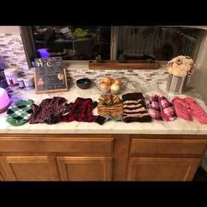 Lot of dog clothes and carrier